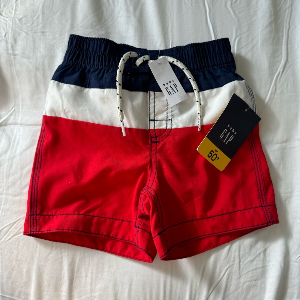 NEW WITH TAGS. Baby Gap boys swim shorts size 18-24.